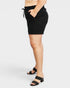 Person wearing a black skirt on a white background