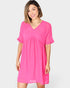 Woman wearing a pink dress on a white background