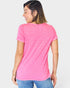 Woman wearing a pink t-shirt and blue jeans on a white background