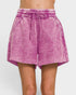 Pink shorts with a drawstring on a white background