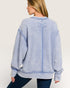 Woman wearing a blue striped sweater on a white background