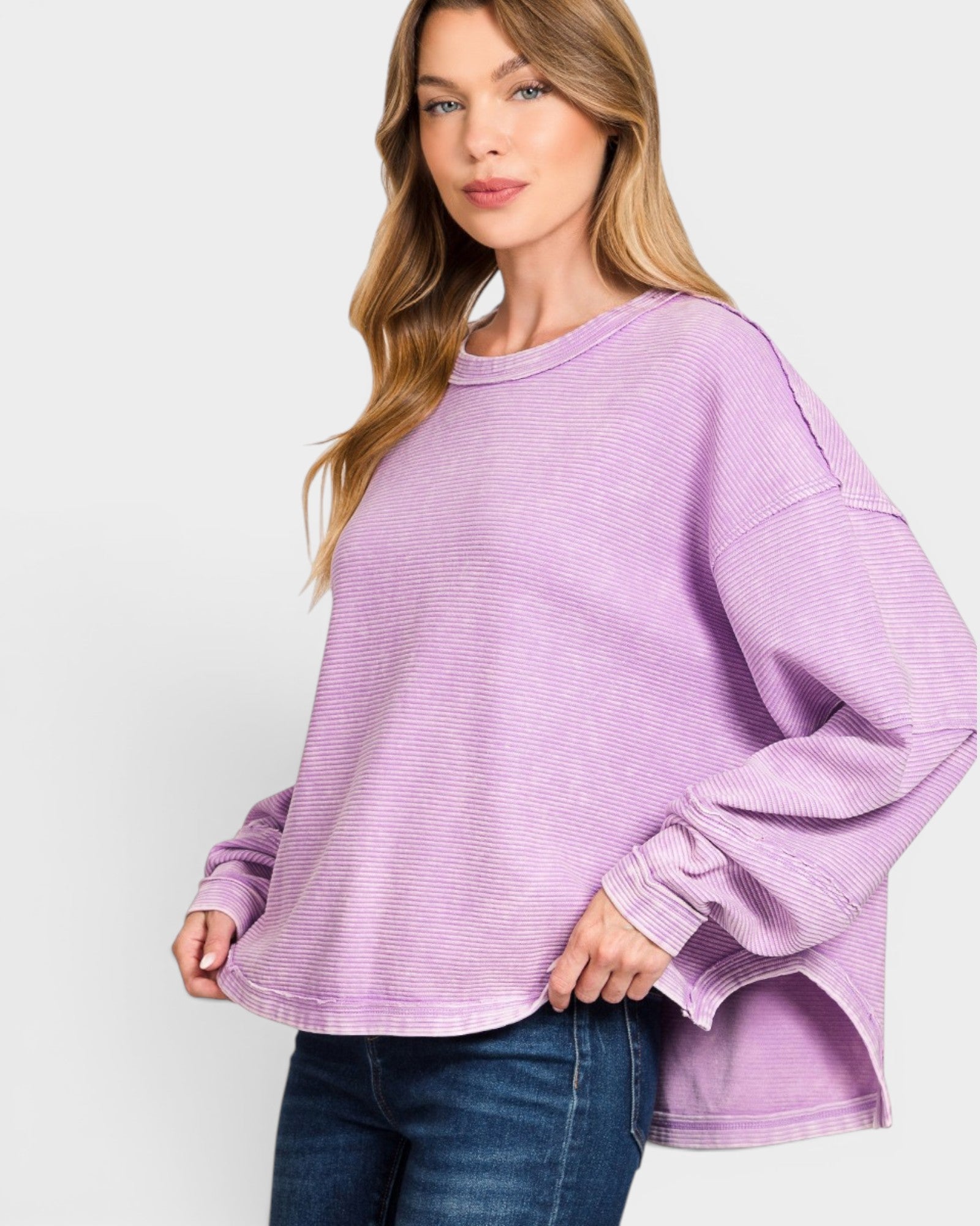 Woman wearing a purple sweater on a white background