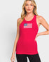Woman wearing a red tank top with an American flag design on a light gray background