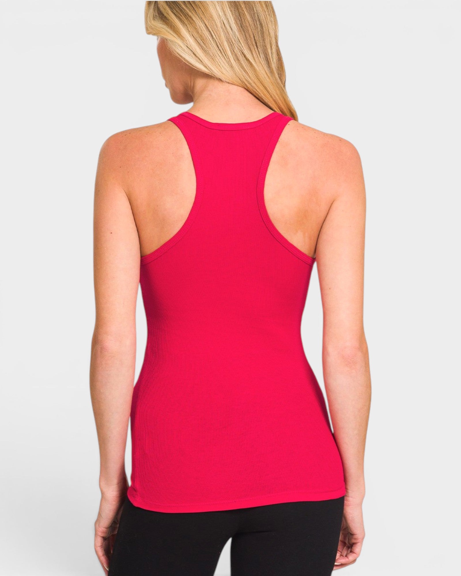Person wearing a red tank top on a plain background