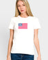 Woman wearing a white t-shirt with an American flag design on a plain background