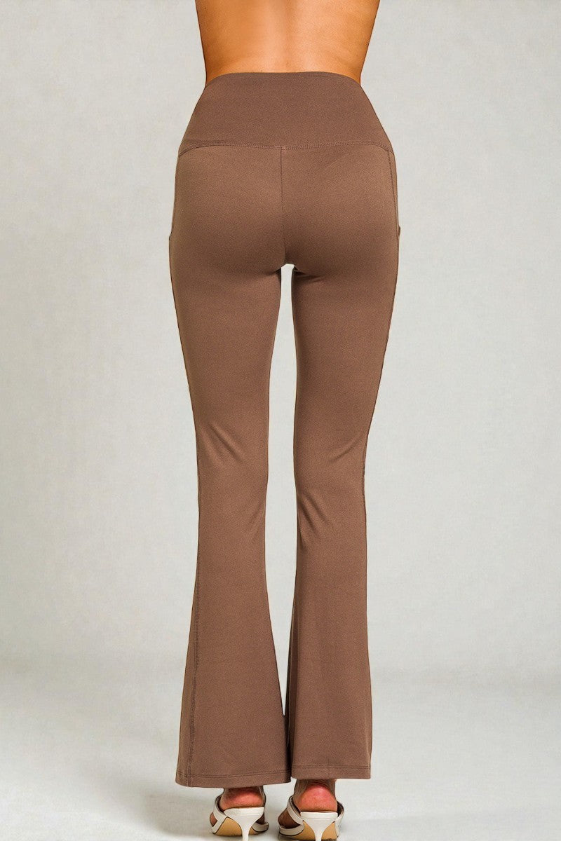 Brown flared pants on a plain background