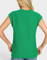 Green sleeveless top worn by a person on a white background