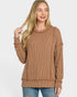 Woman wearing a brown sweater on a white background