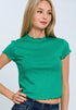 Woman wearing a green top with ruffled sleeves on a white background
