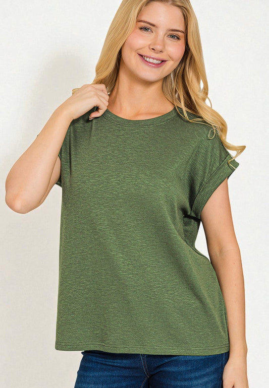 Woman wearing a green t-shirt on a white background