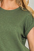 Green t-shirt worn by a person with a neutral background