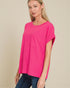 Woman wearing a bright pink t-shirt with a pocket on a beige background