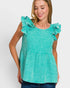 Woman wearing a teal top with ruffled shoulders on a white background