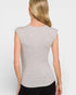 Woman wearing a gray sleeveless top against a white background