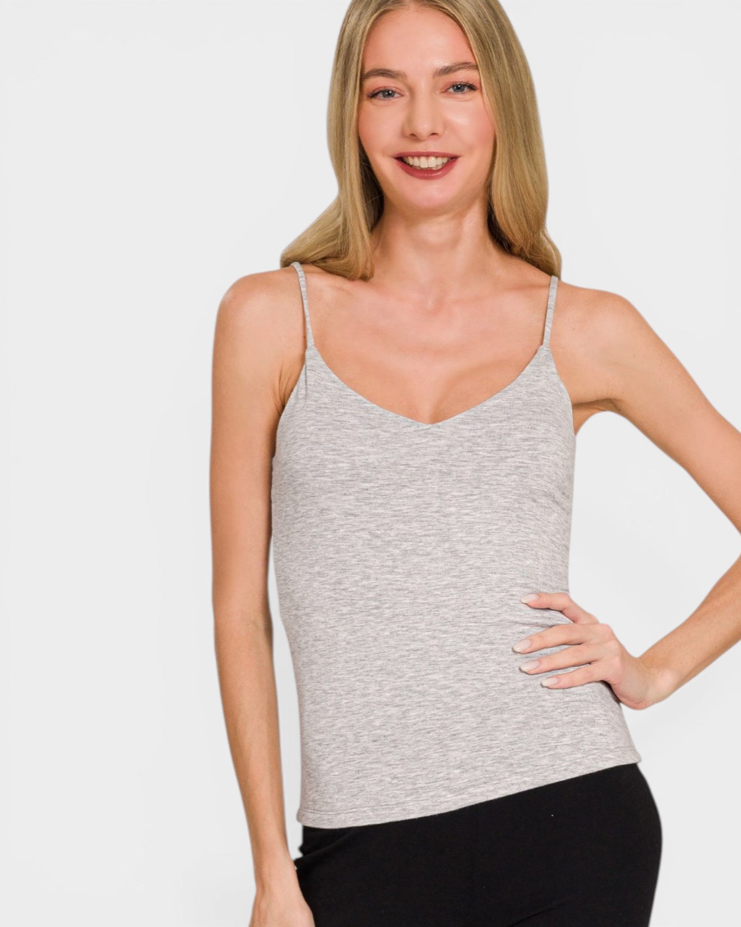 Woman wearing a gray tank top against a white background