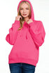 Person wearing a bright pink hoodie on a white background
