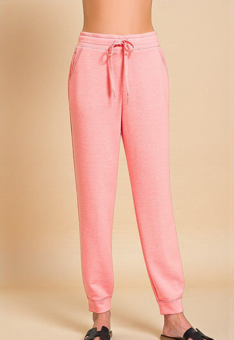Pink sweatpants on a beige background