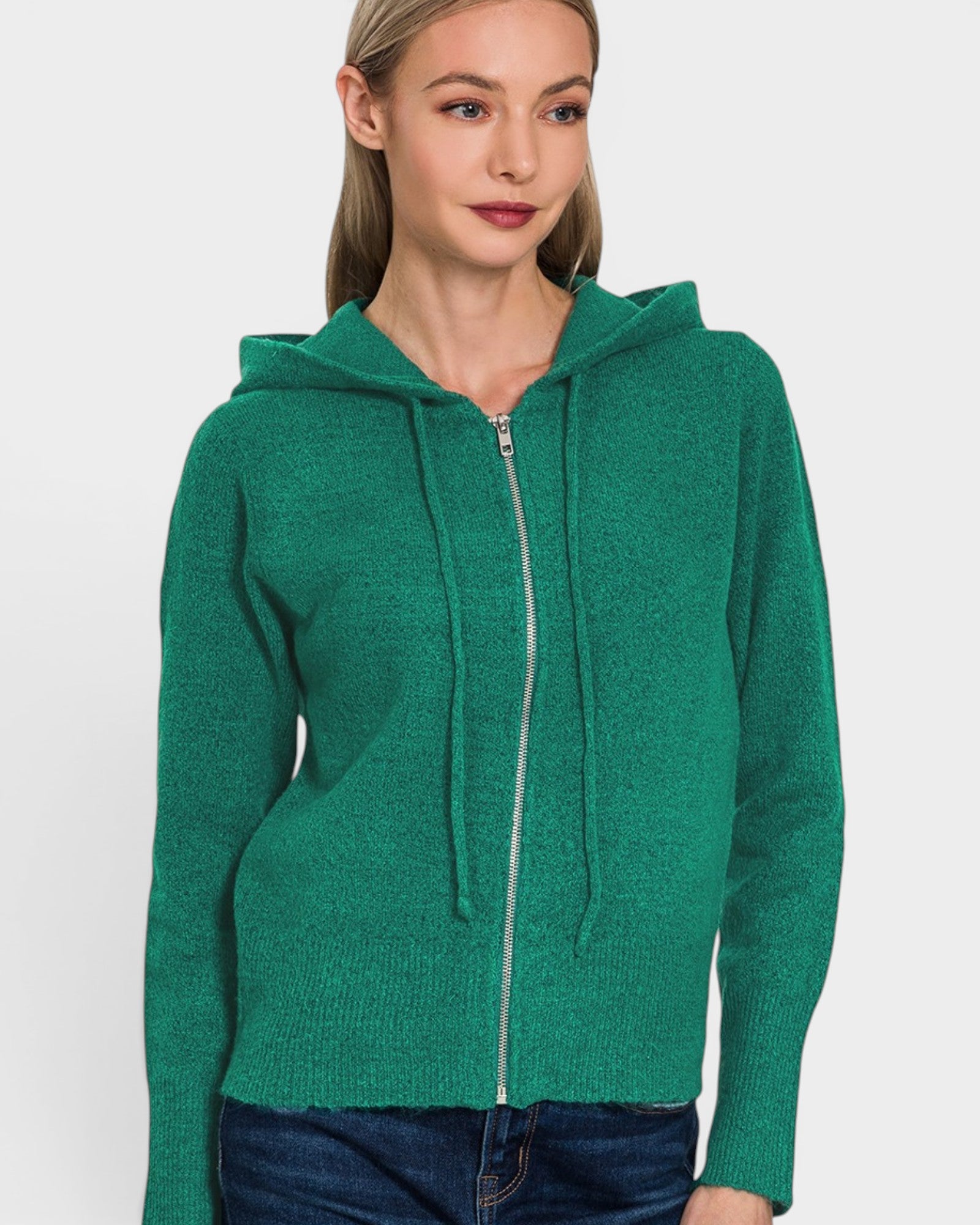 Woman wearing a green hoodie on a white background