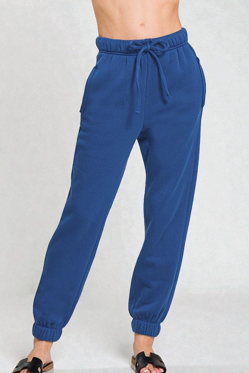 Blue jogger pants on a white background