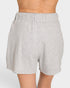 Gray shorts worn by a person on a white background