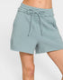 Light blue shorts with a drawstring on a white background