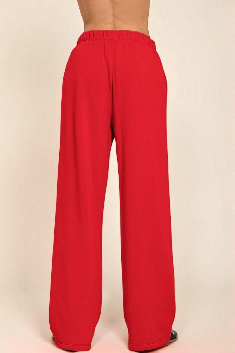 Red pants on a beige background