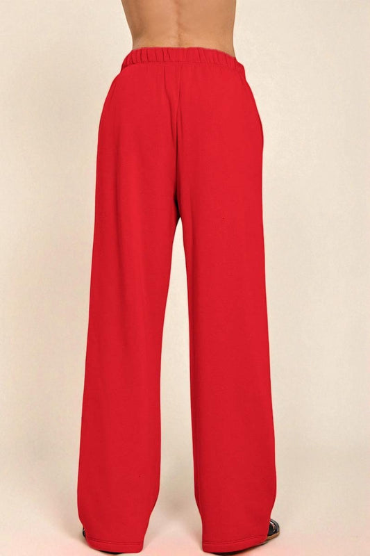Red pants on a beige background