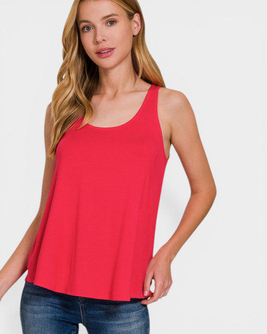 Woman wearing a red tank top against a white background