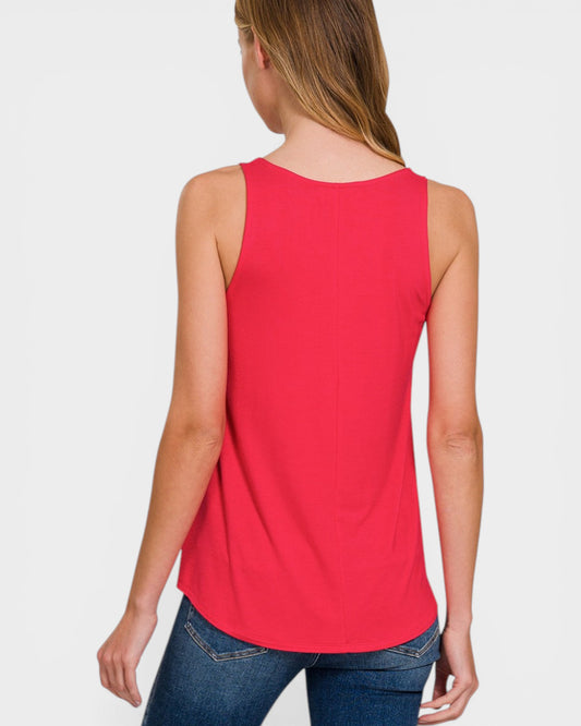 Woman wearing a red tank top on a white background