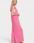 Woman wearing a pink dress on a white background