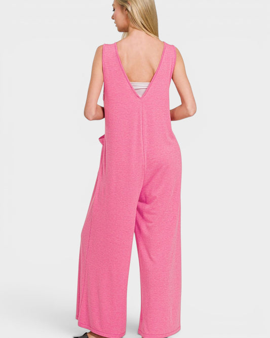 Pink jumpsuit worn by a person on a white background