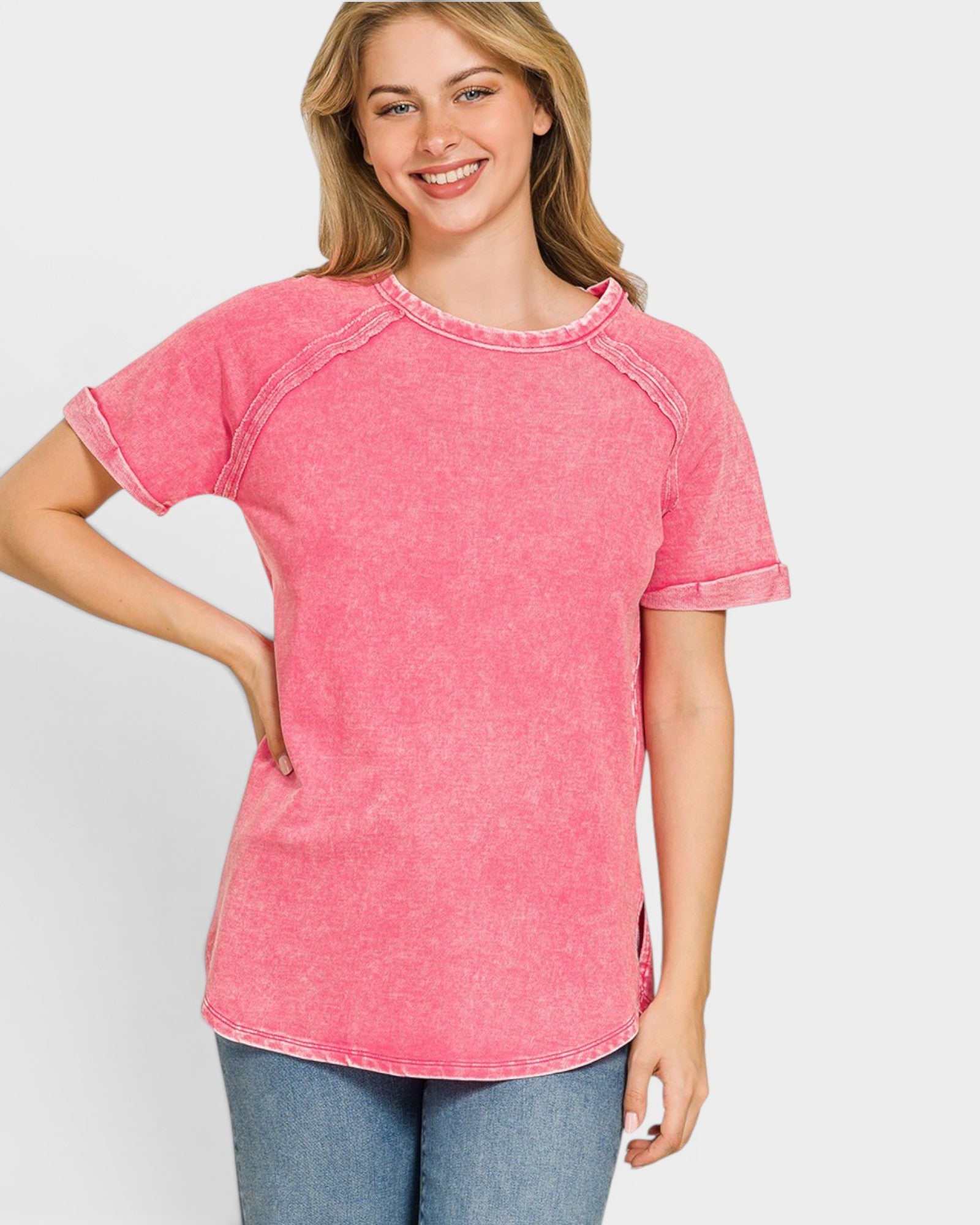 Woman wearing a pink t-shirt with a white background