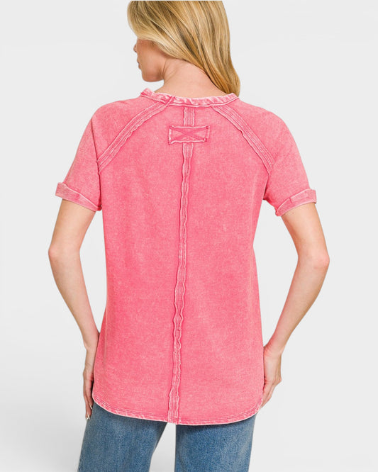 Woman wearing a pink short-sleeve shirt on a white background