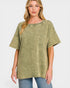 Woman wearing a green oversized t-shirt with a pocket on a white background