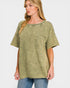 Woman wearing a green oversized t-shirt with a pocket on a white background