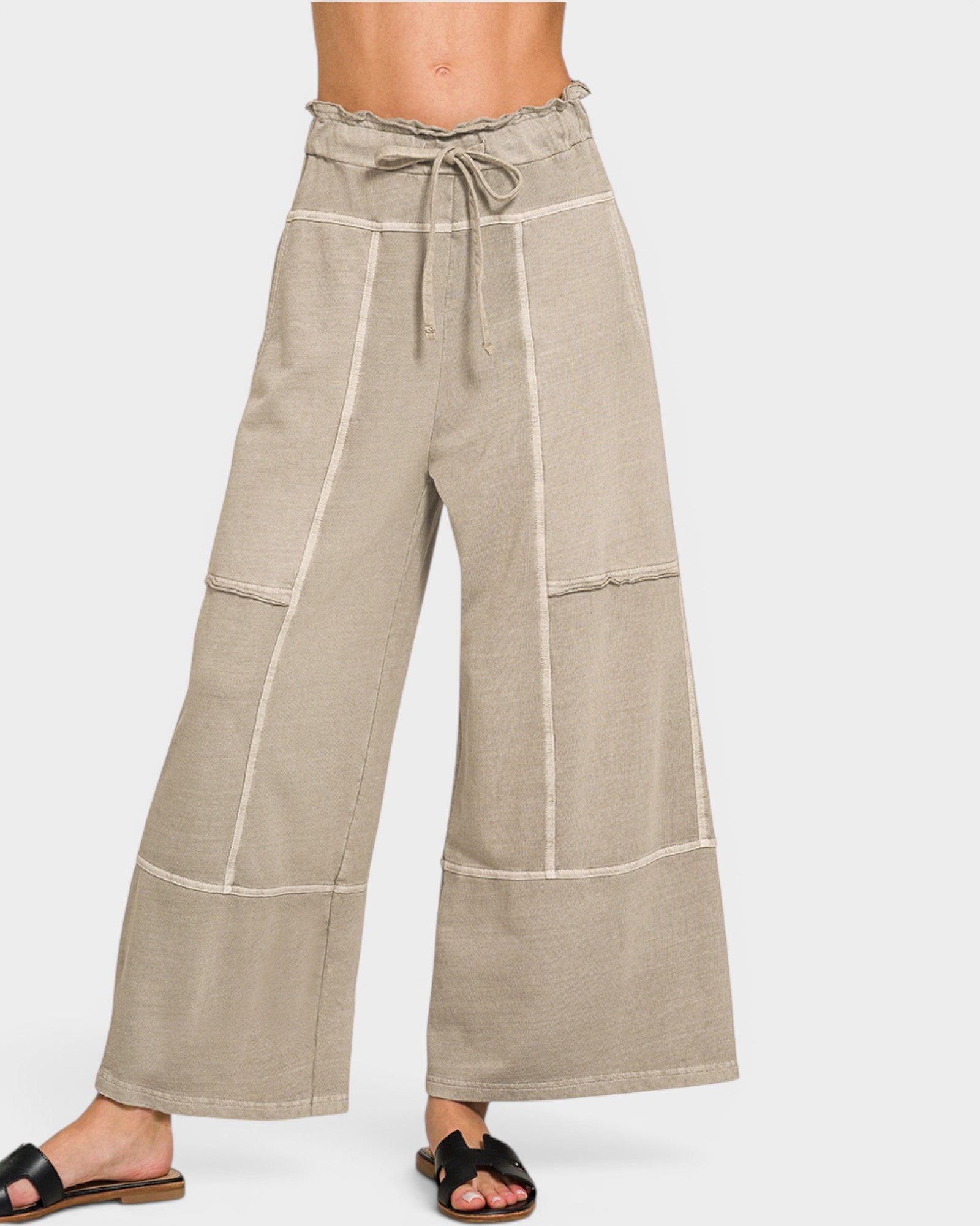 Beige wide-leg pants with white stripes on a white background