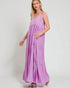Woman wearing a purple maxi dress on a white background