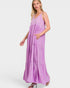 Woman wearing a purple maxi dress on a white background