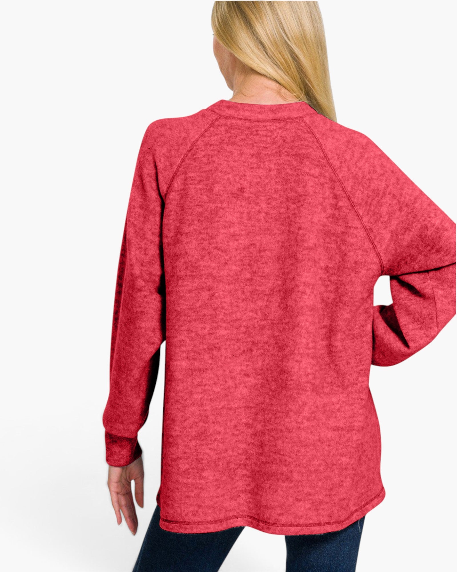 A woman shown from the back wearing a heathered red long-sleeve raglan sweatshirt and dark blue jeans against a plain white background.