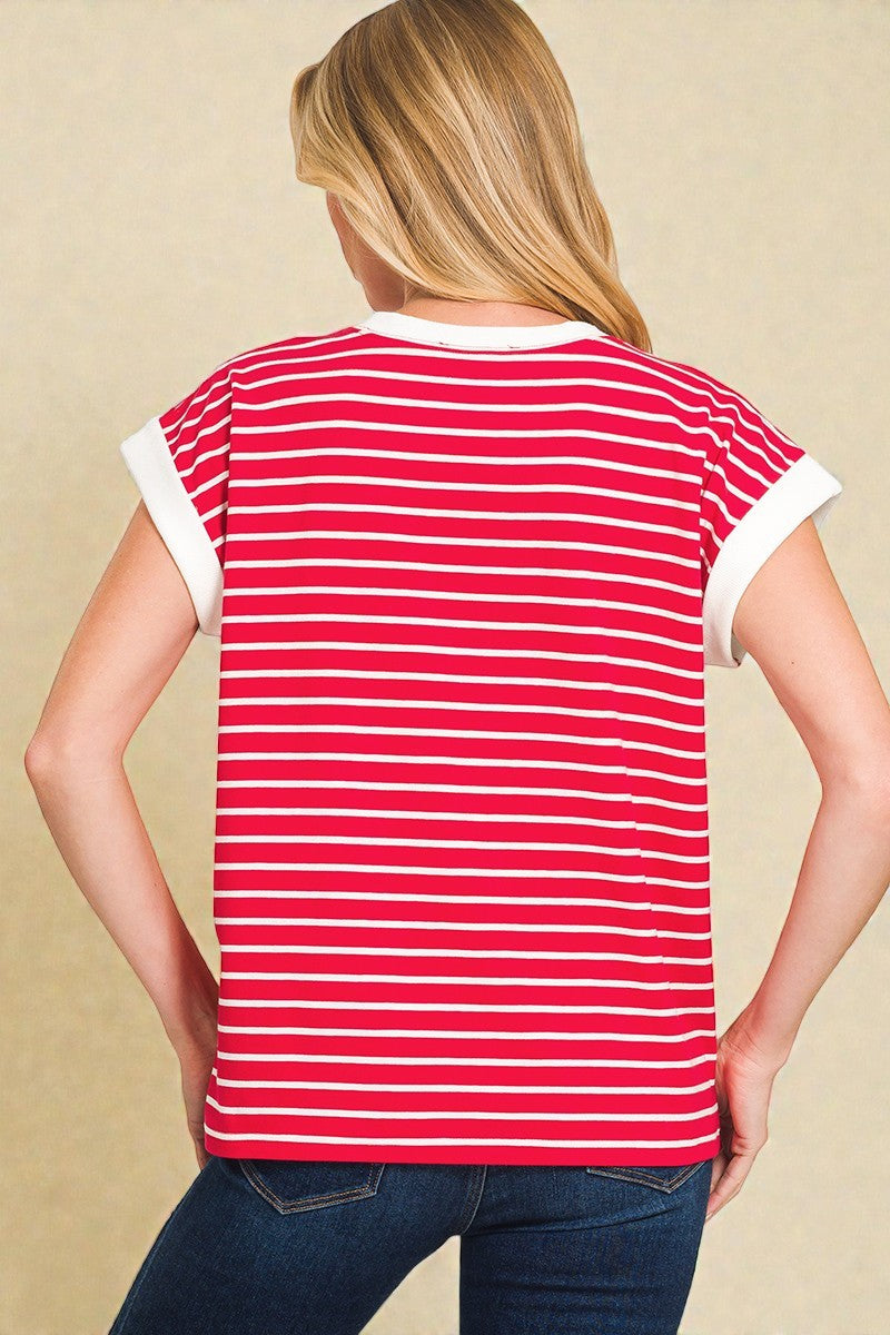 Person wearing a red and white striped shirt on a beige background