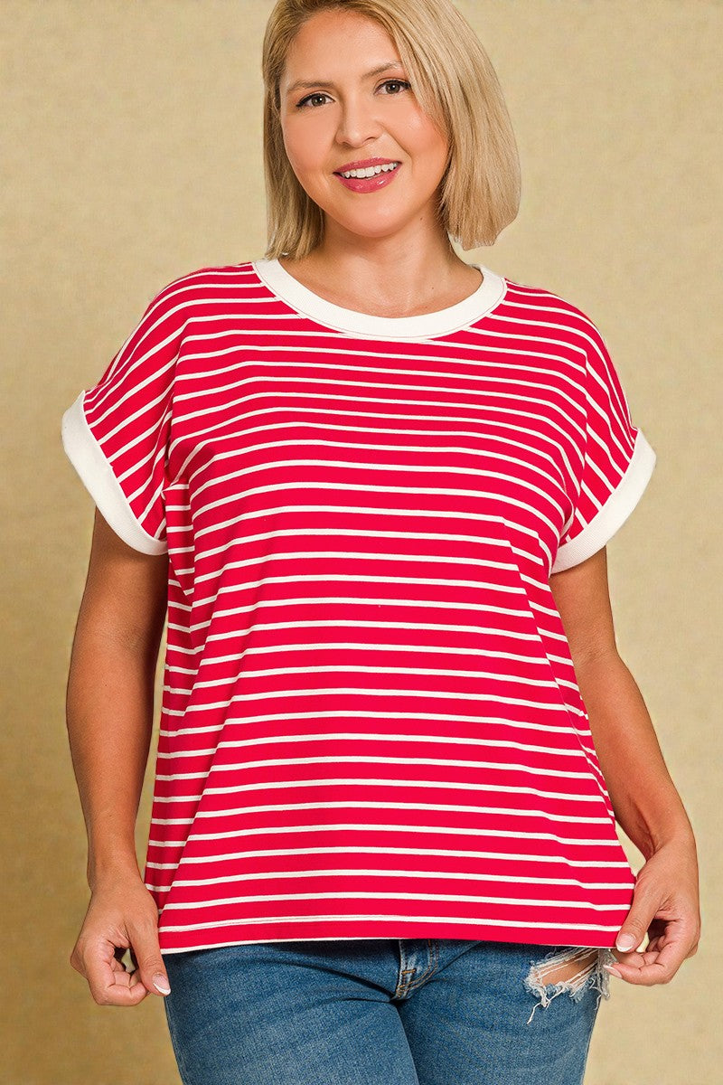 Woman wearing a red and white striped shirt against a beige background