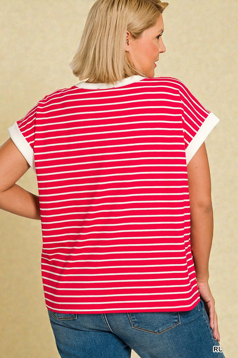 Woman wearing a red and white striped shirt against a beige background