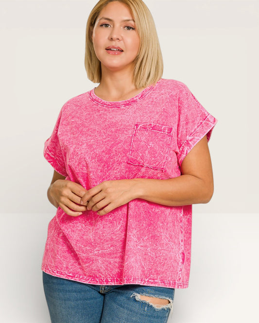 Woman wearing a pink acid-wash t-shirt on a white background