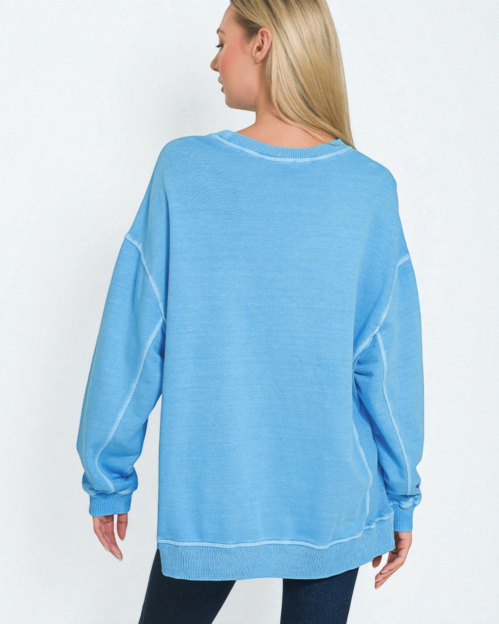 Person wearing a blue sweatshirt on a white background