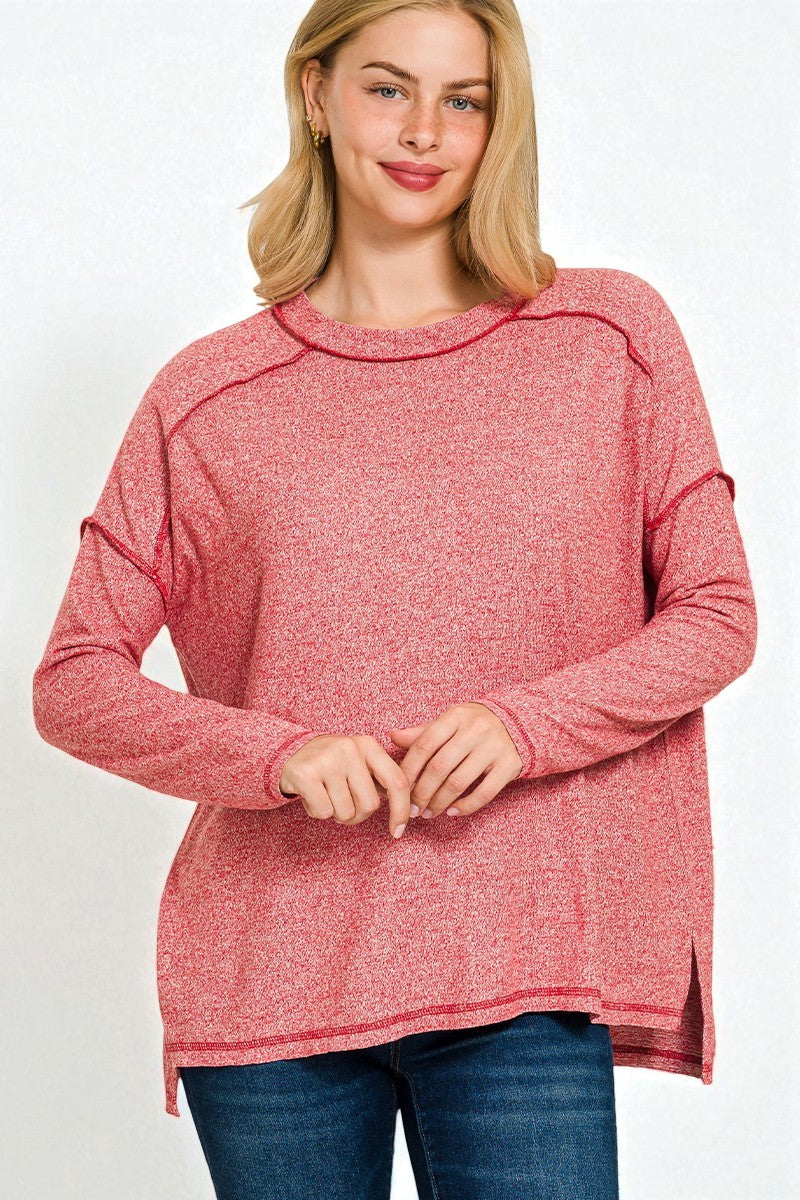 Woman wearing a red sweater on a white background