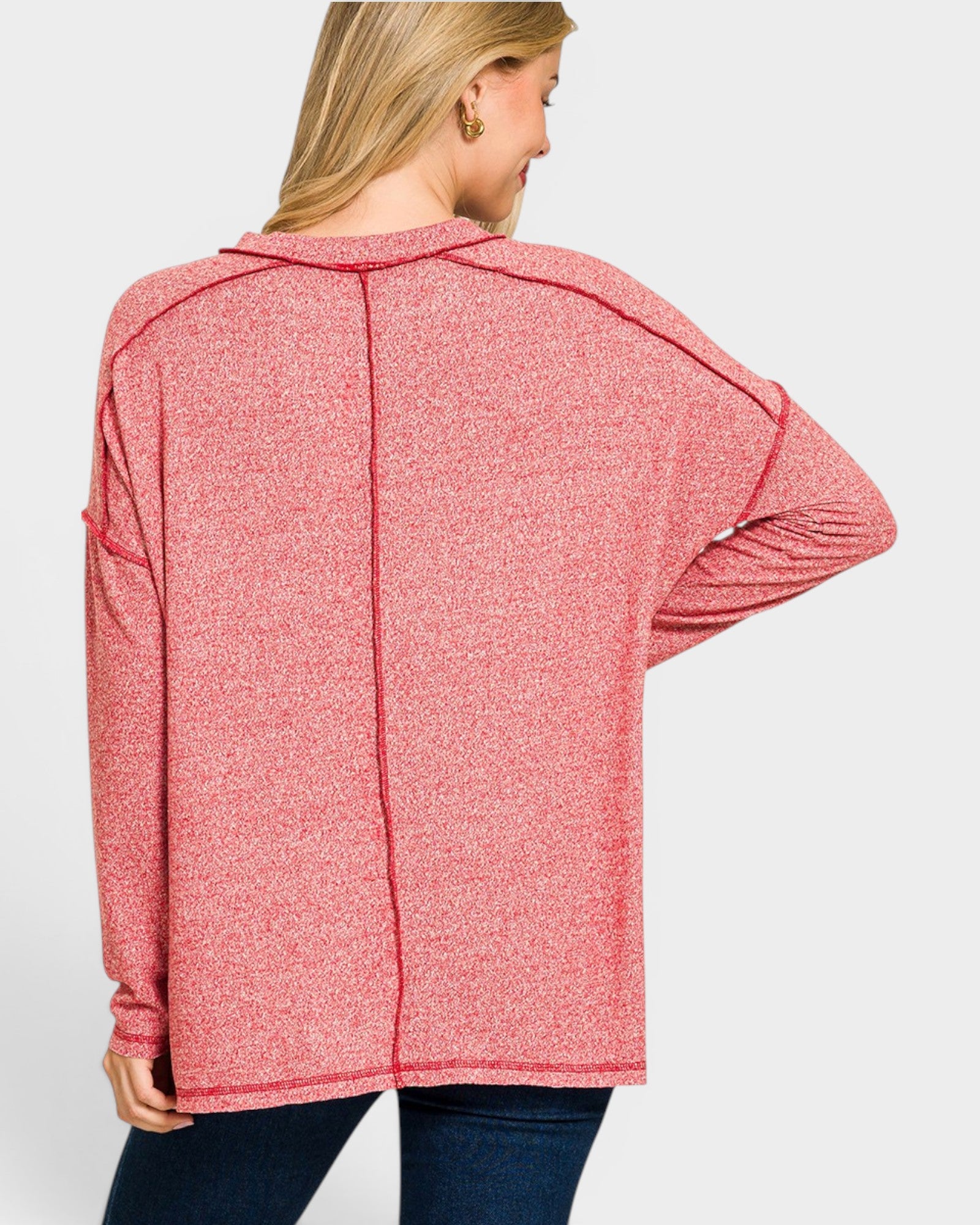 Woman wearing a pink cardigan on a white background