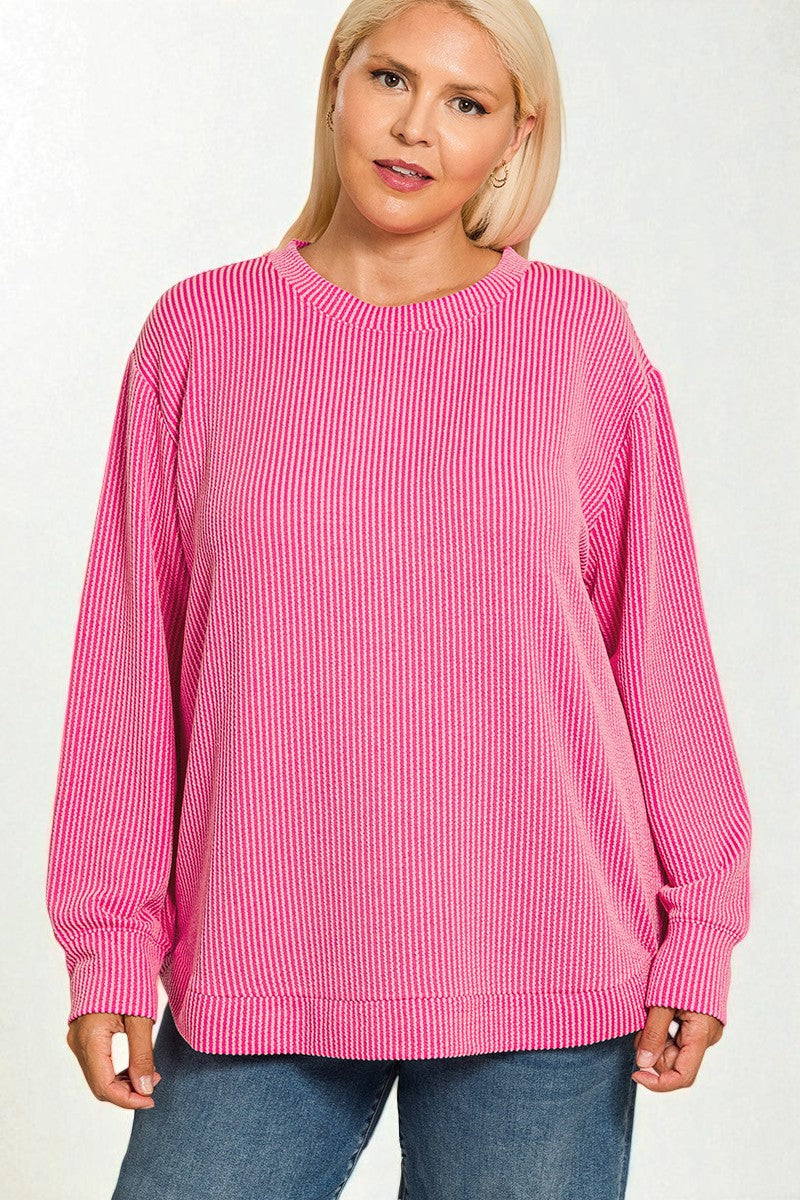 Person wearing a pink striped sweater on a white background