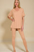 Woman wearing a beige outfit on a beige background