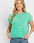 Woman wearing a green distressed t-shirt with a pocket on a white background