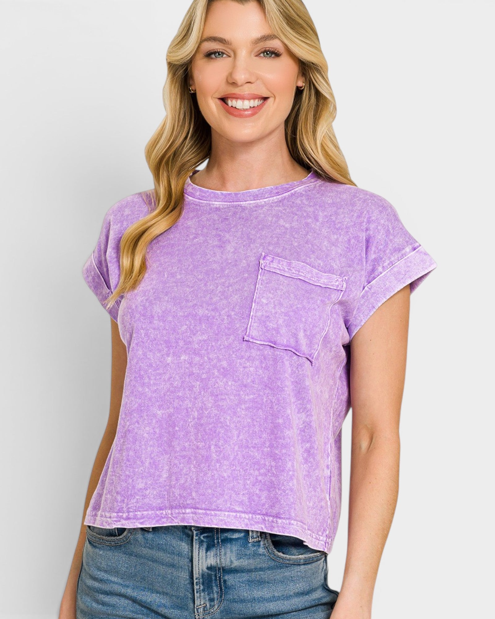 Woman wearing a purple t-shirt with a pocket on a white background